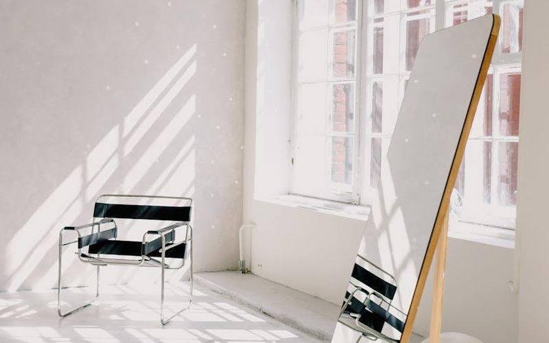 A spacious, bright living room prepared for a home workout.